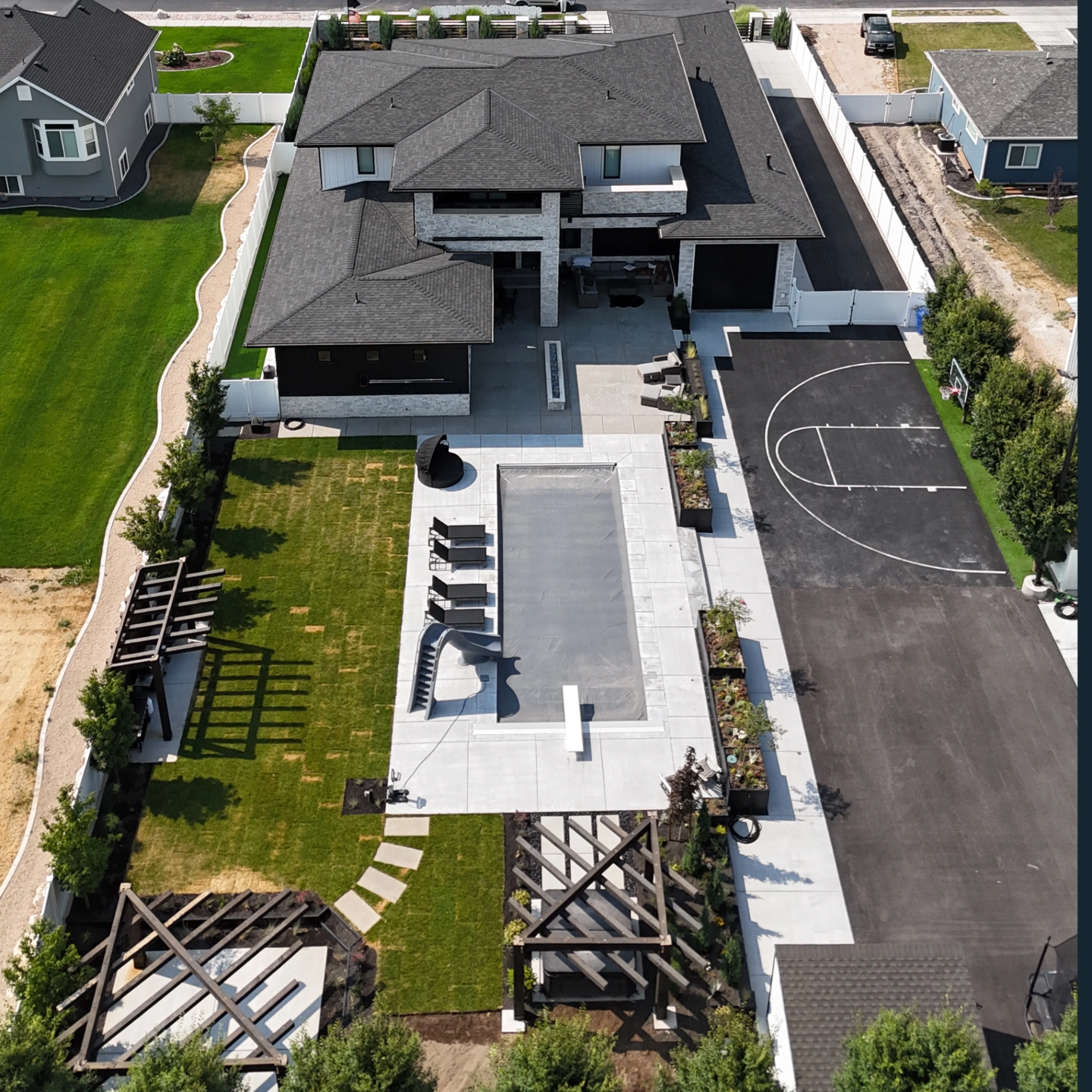 Backyard pool and court aerial view